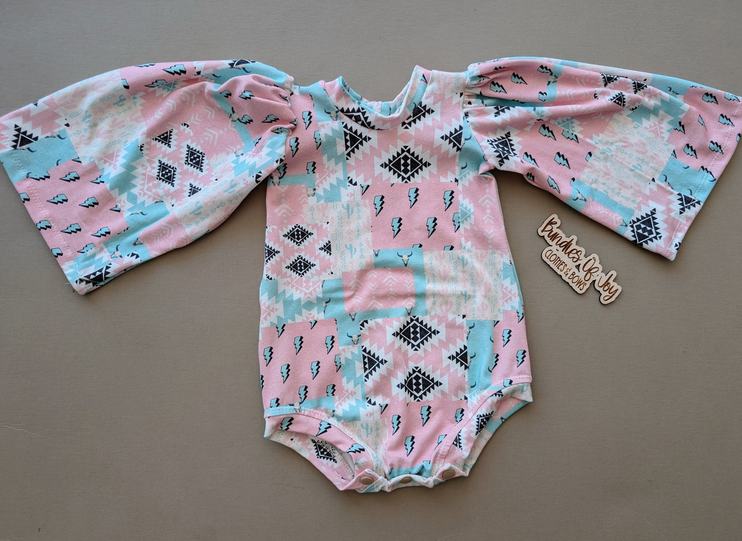 9/12 bodysuit with unhemmed bishop sleeves